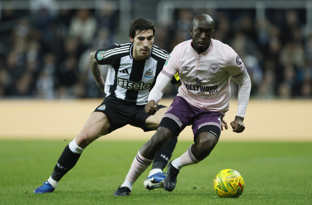 Yoane Wissa protects the ball from Sandro Tonali during Newcastle United vs Brentford in the Carabao Cup.