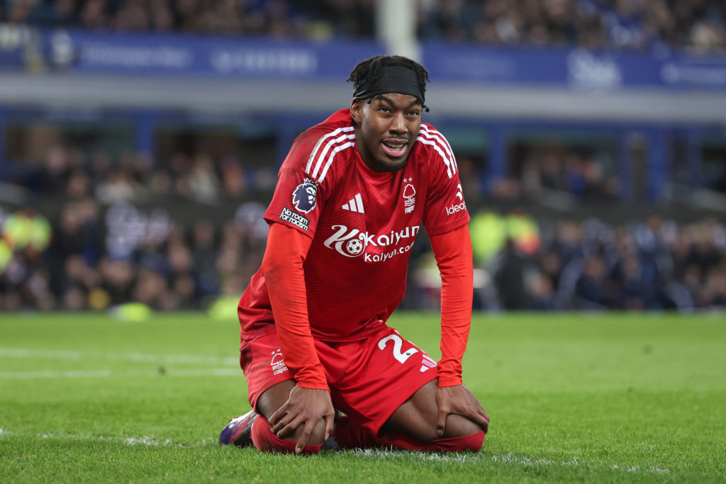 Anthony Elanga kneels on the pitch during Nottingham Forest's Premier League game against Everton at Goodison Park.