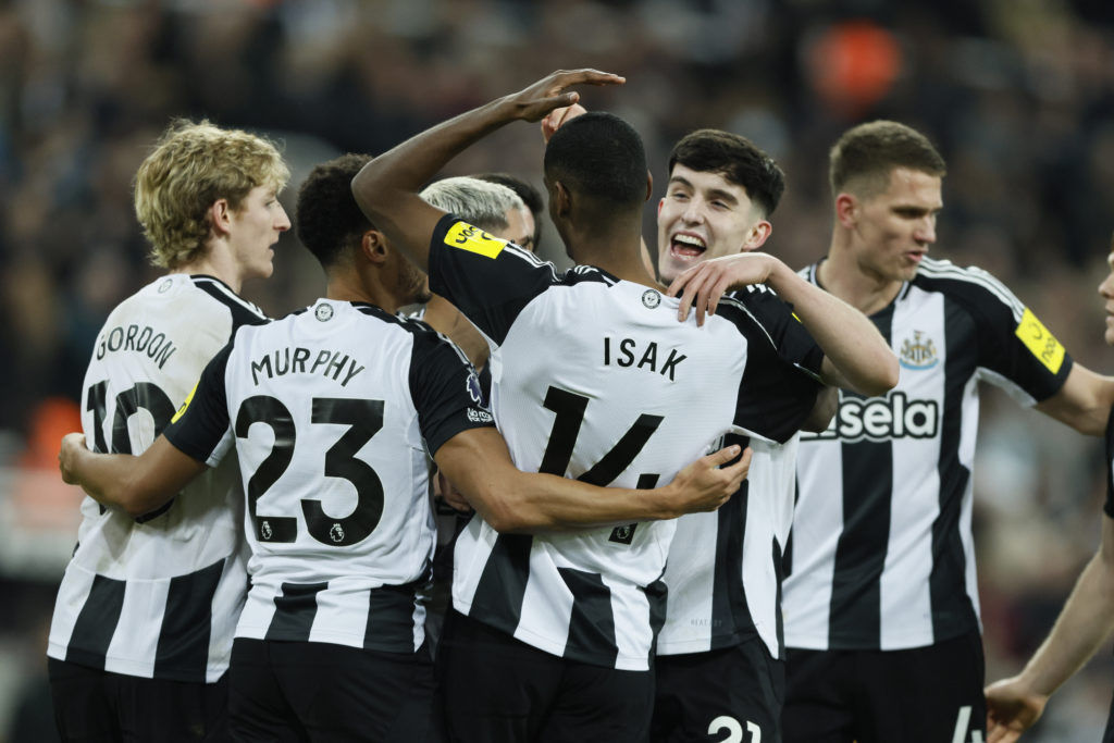 Alexander Isak and Tino Livramento celebrate together after Newcastle United score against Wolves.