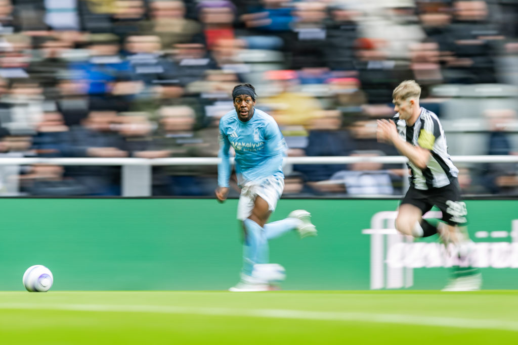 Anthony Elanga runs with the ball past Lewis Hall during Newcastle United vs Nottingham Forest.