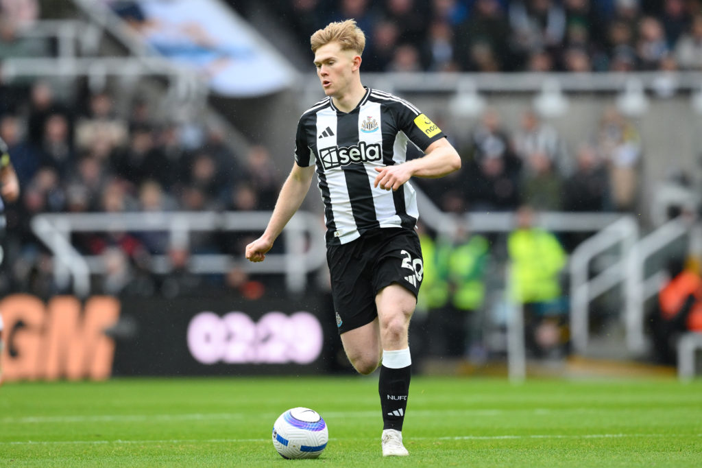 Lewis Hall runs with the ball during Newcastle United's Premier League game against Nottingham Forest.