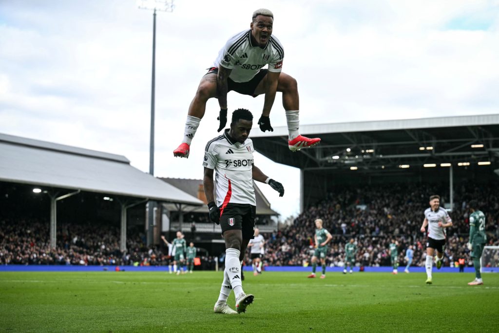 Rodrigo Muniz leaps over Ryan Sessegnon to celebrate a goal for Fulham.