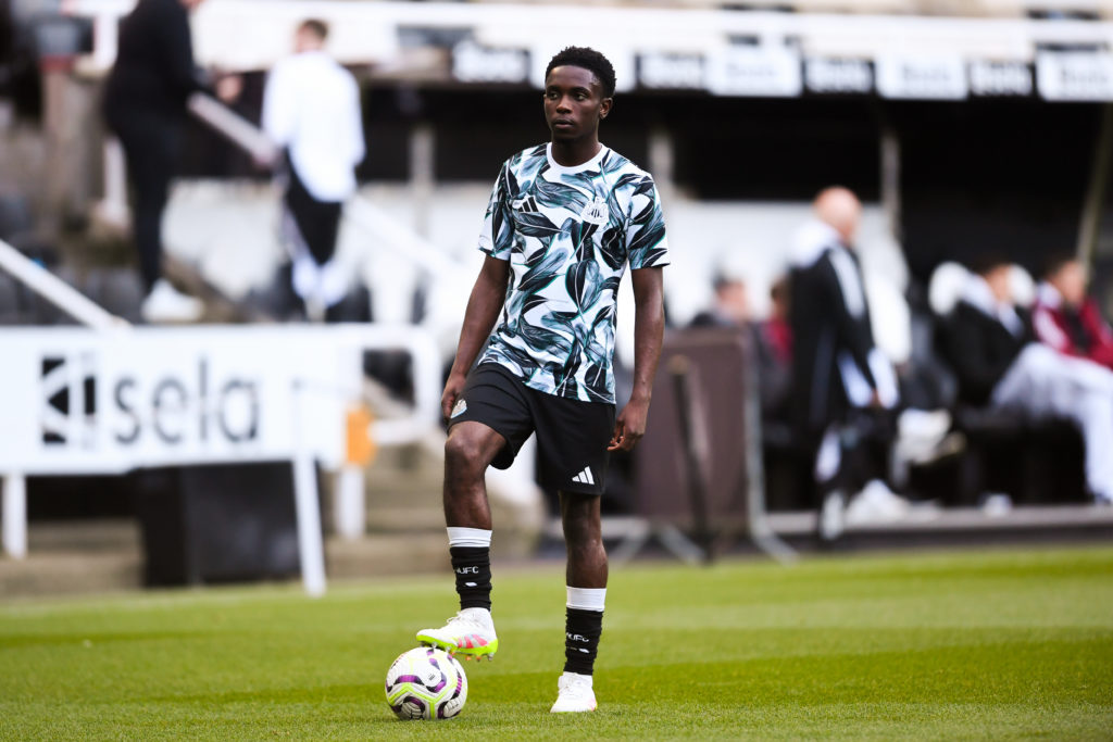 Anthony Munda stands on a ball ahead of a Newcastle U21s match.