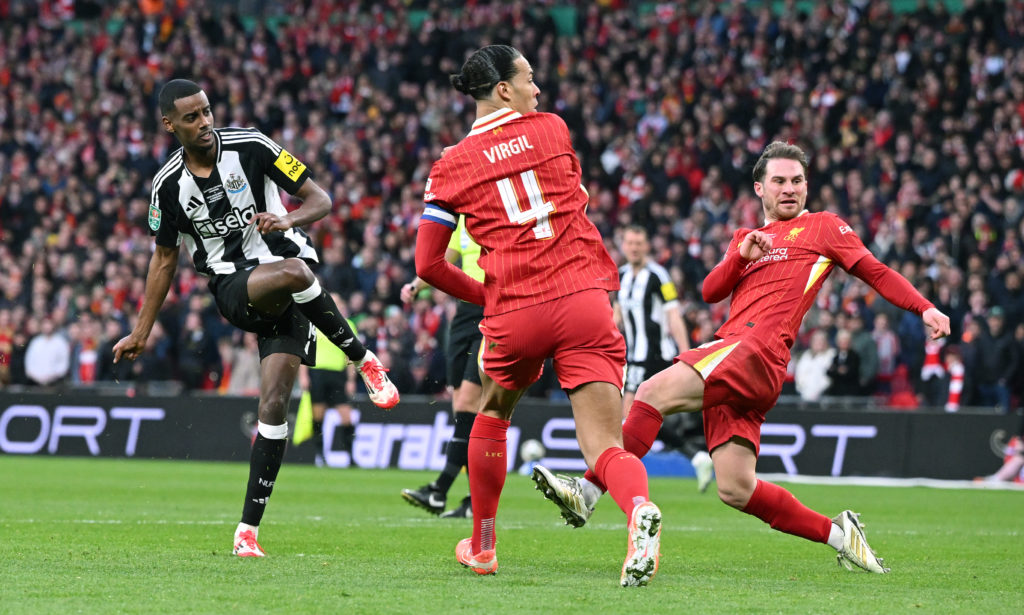 Alexander Isak shoots to score Newcastle United's second goal against Liverpool in the Carabao Cup final.