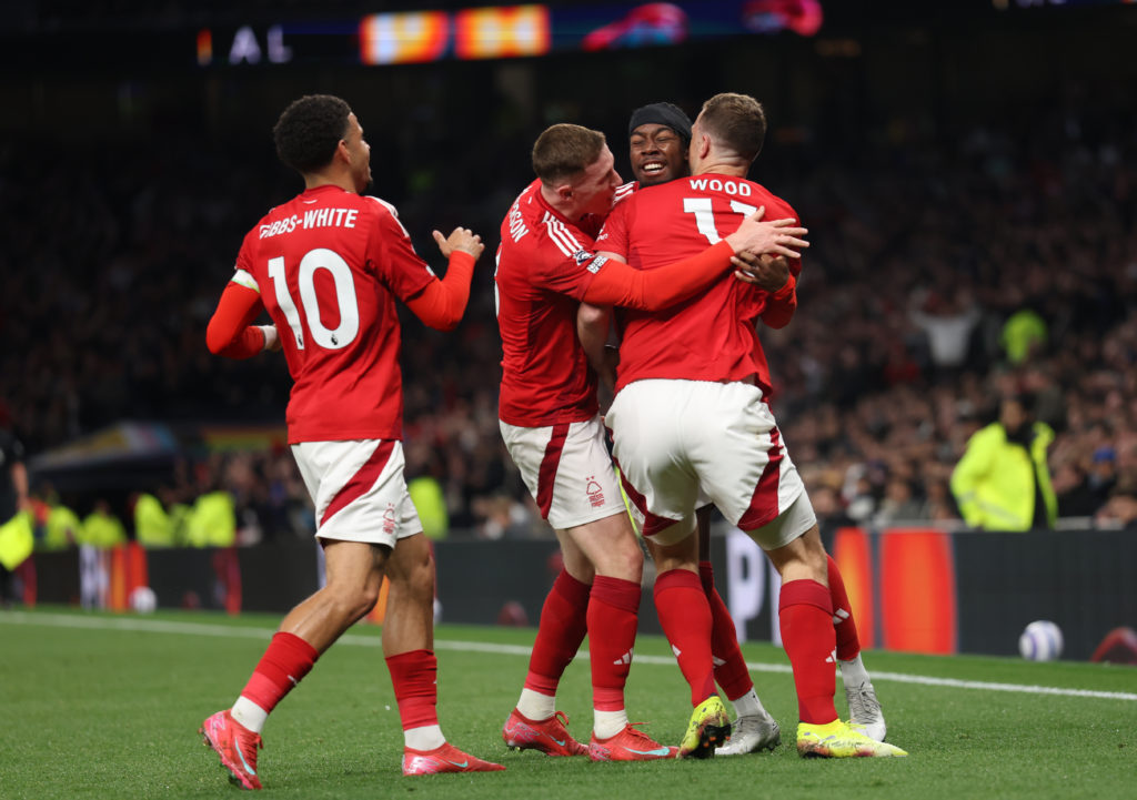 Nottingham Forest players embrace after a goal during a game between Tottenham Hotspur and Nottingham Forest