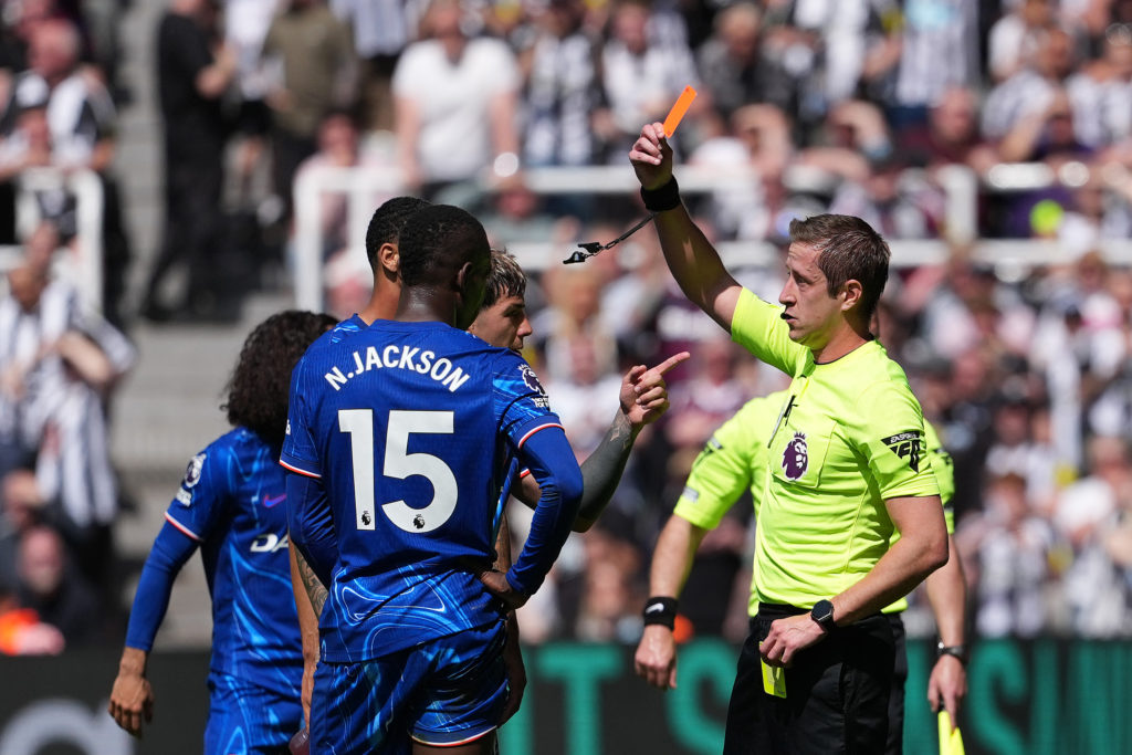 Nicolas Jackson is shown a red card during a Premier League game between Newcastle United and Chelsea.