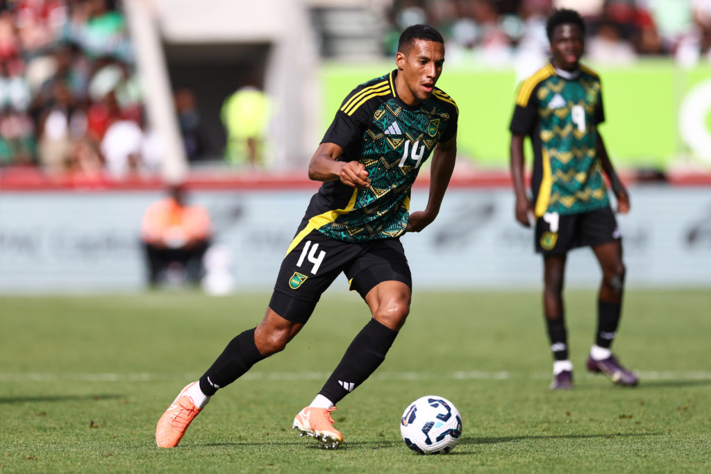Isaac Hayden on the ball during an international game between Jamaica and Nigeria.