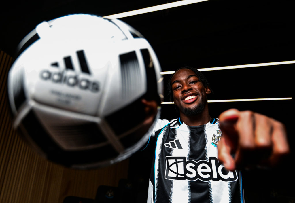 Anthony Elanga poses after signing for Newcastle United.