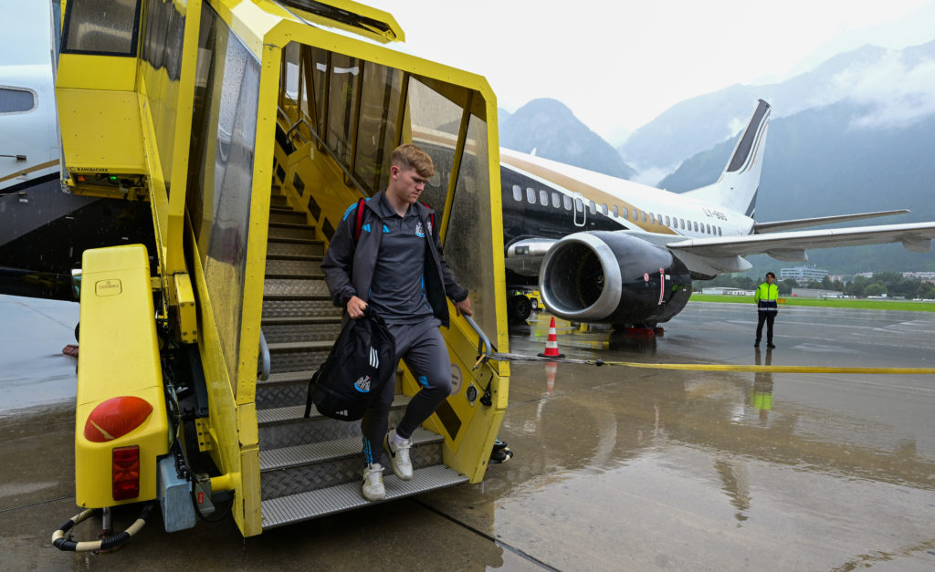 Lewis Hall departs the plane for Newcastle United's pre-season training in Austria.
