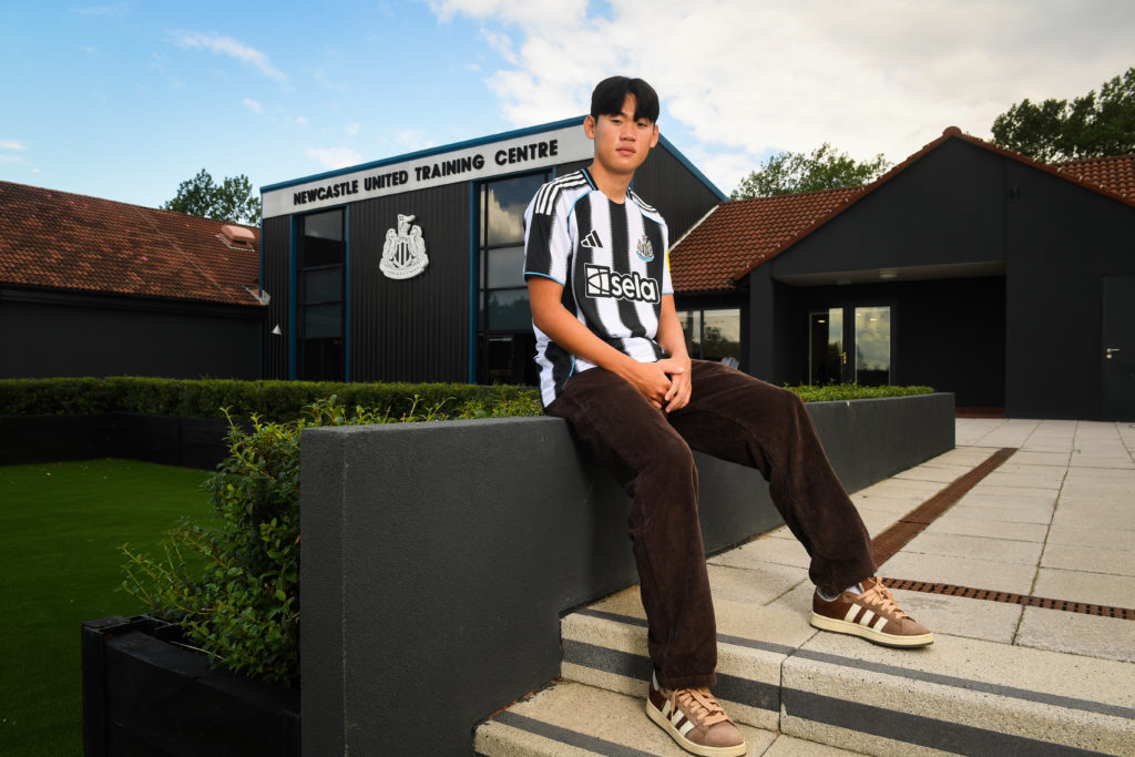 Park Seung-soo sits in front of the Newcastle United training ground after signing for the club.