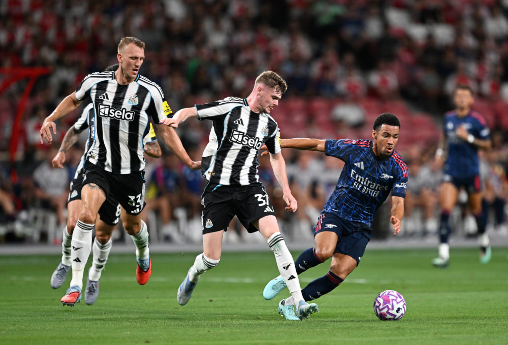 Alex Murphy challenges Ethan Nwaneri for the ball during Newcastle United vs Arsenal in a friendly.