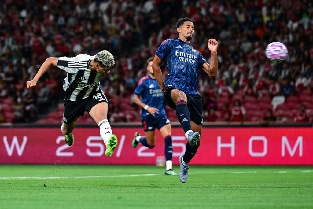 William Osula heads the ball for Newcastle United against Arsenal.