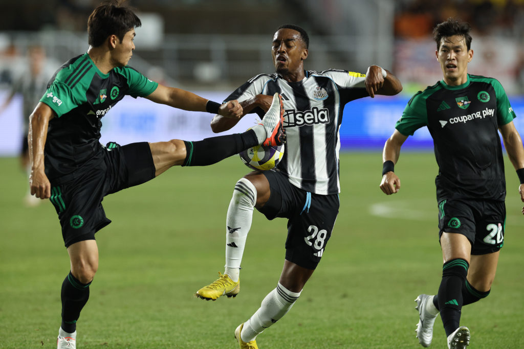 Joe Willock is tackled during Newcastle vs Team K League.