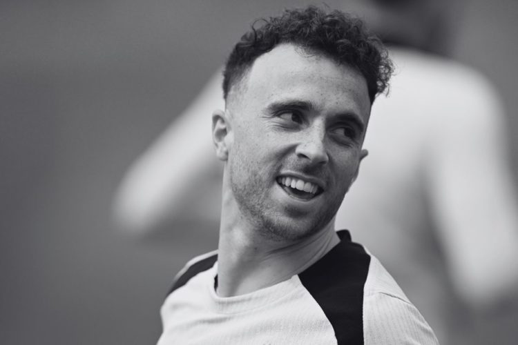 A black and white close up image of Diogo Jota in Liverpool training.
