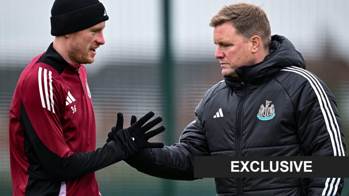 Eddie Howe shakes hands with Sean Longstaff during a Newcastle United training session.