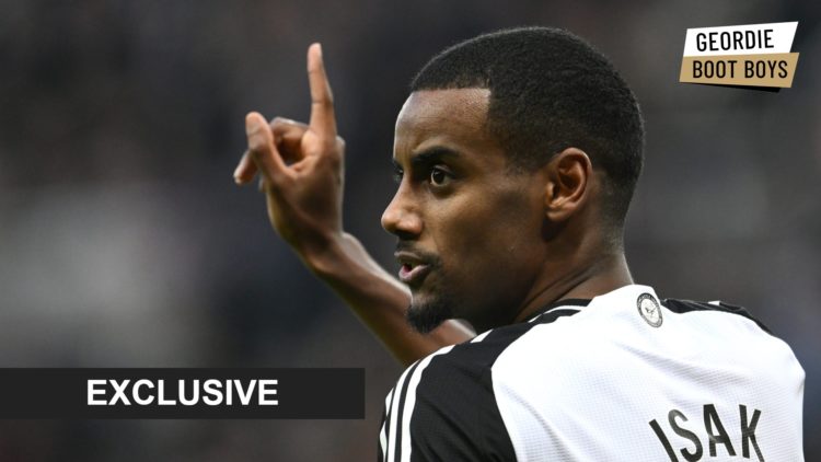 Alexander Isak holds up his hand during a Newcastle United game