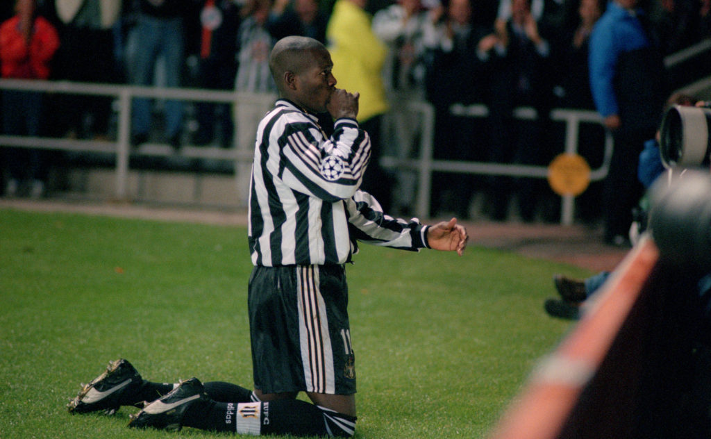 Tino Asprilla celebrates after scoring his third goal in a Champions League game between Newcastle United and Barcelona.