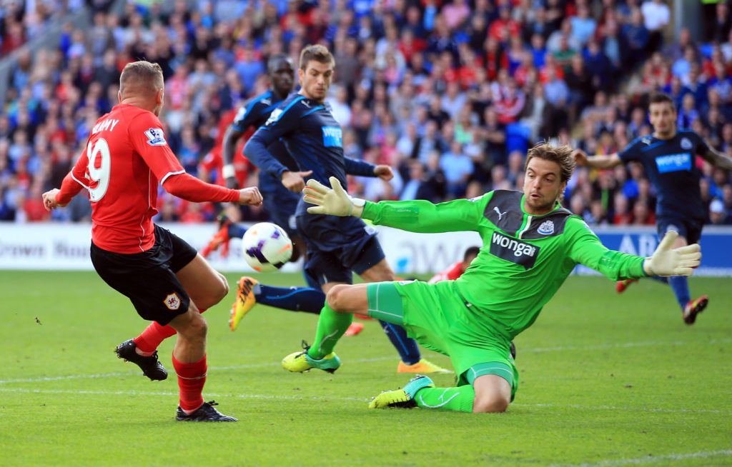 Tim Krul dives for the ball during a Premier League game between Cardiff City and Newcastle United.