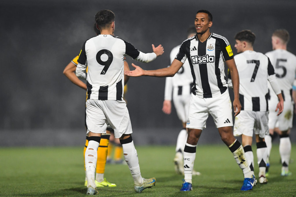 Isaac Hayden celebrates with teammates after a goal in a National League Cup game between Boston United and Newcastle United.