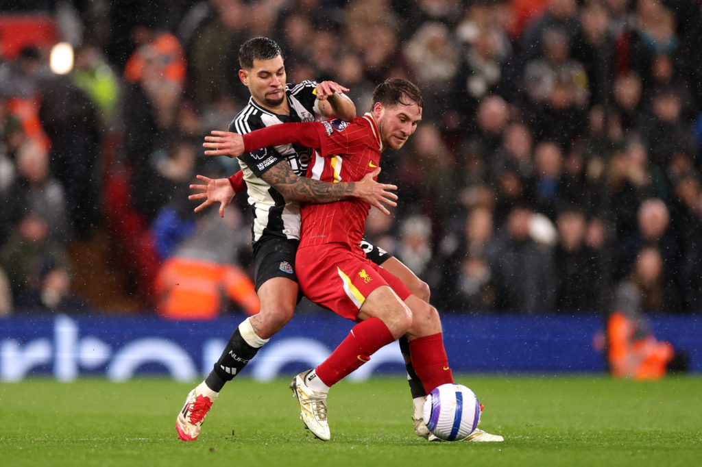 Bruno Guimaraes and Alexis Mac Allister battle for the ball in Liverpool vs Newcastle United.