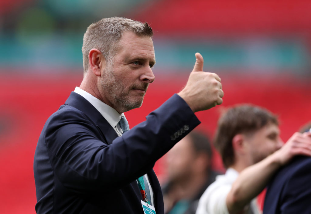Peterborough United chairman Darragh MacAnthony gives a thumbs up at Wembley Stadium.