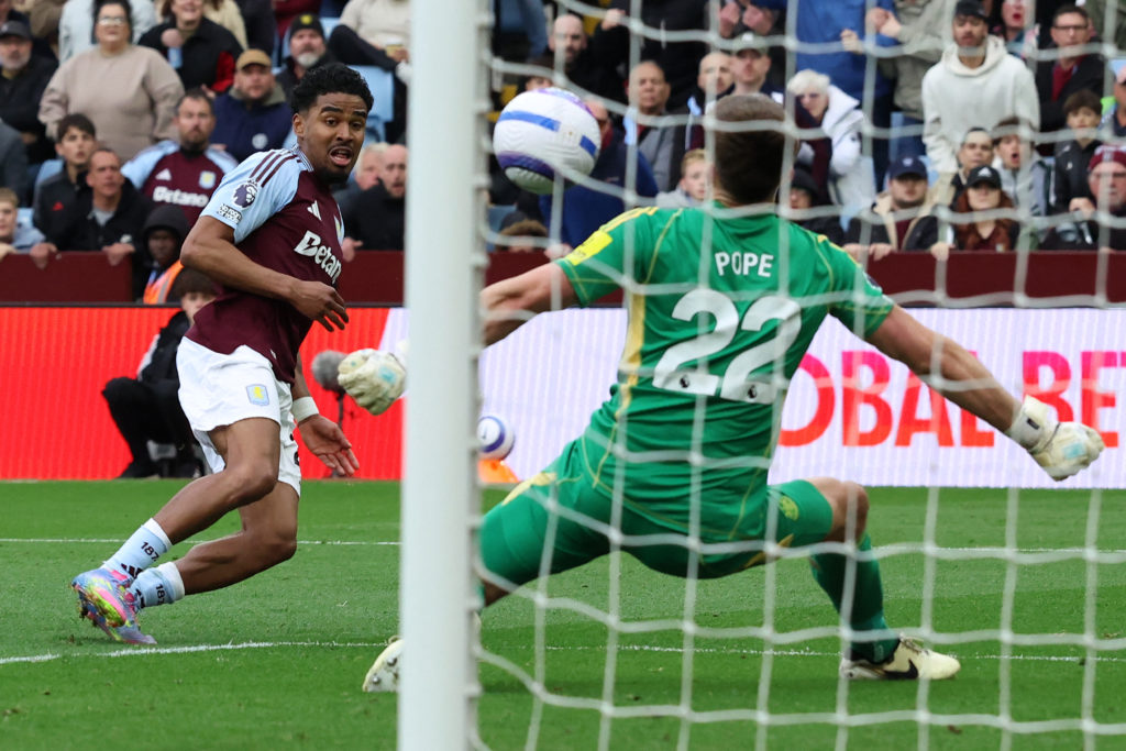 Ian Maatsen scores during a Premier League game between Aston Villa and Newcastle United.