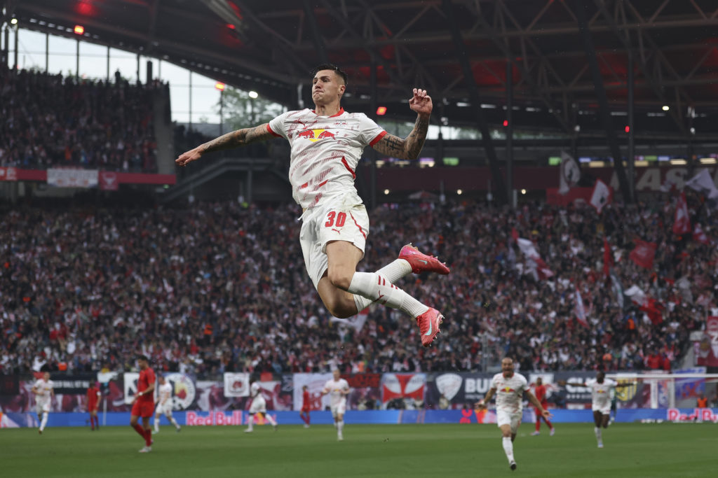 Benjamin Sesko celebrates after scoring in a Bundesliga game between RB Leipzig and Bayern Munich.