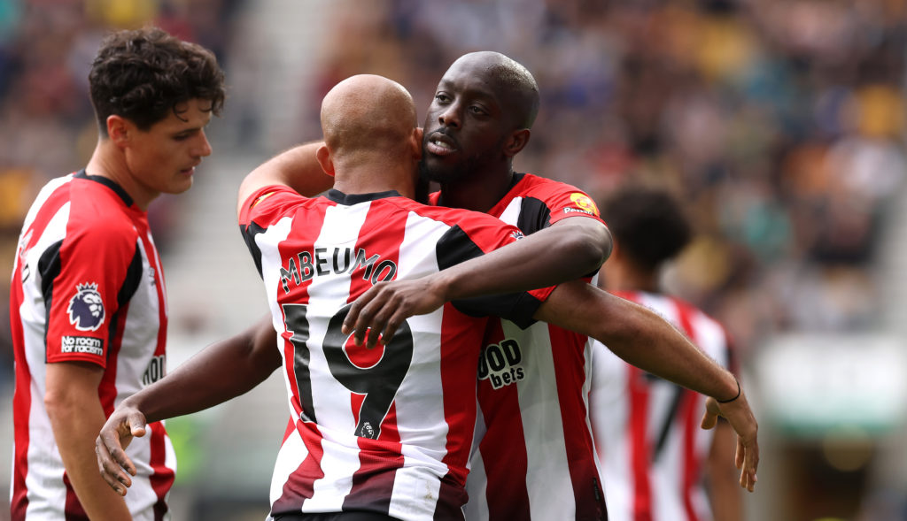 Yoane Wissa hugs Bryan Mbeumo during a game between Wolves and Brentford.