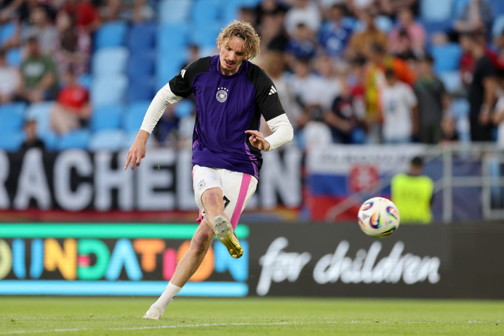 Nick Woltemade warms up before a game between England and Germany U21s.