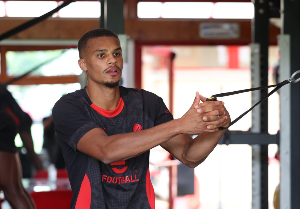 Malick Thiaw works out in the gym during AC Milan's pre-season.