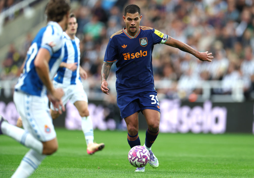 Bruno Guimaraes carries the ball during a friendly between Newcastle United and RCD Espanyol.
