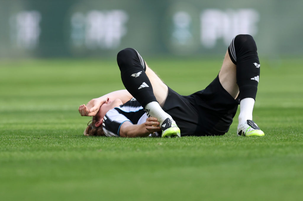 Anthony Gordon lies on the floor in pain after suffering an injury.