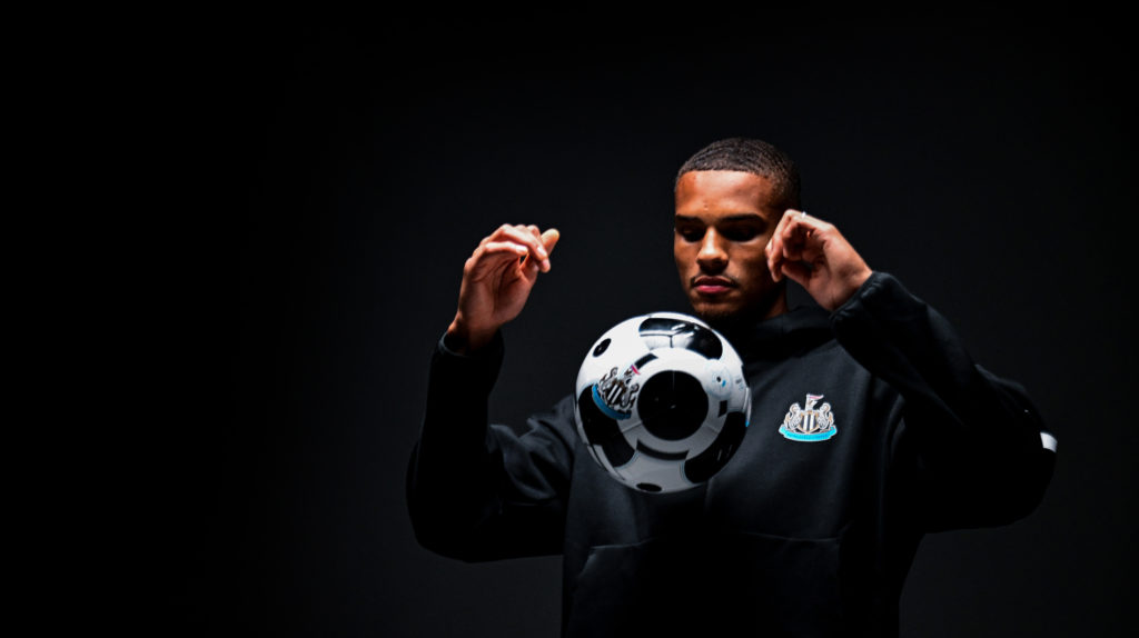 Malick Thiaw juggles a football during his Newcastle United unveiling.