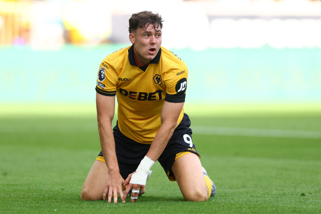 Jorgen Strand Larsen on the ground during a Premier League game between Wolves and Manchester City.