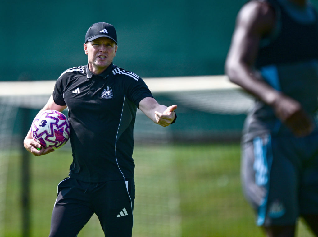 Eddie Howe talks to his players during a Newcastle United training session.