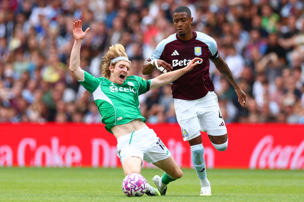 Aston Villa defender Ezri Konsa fouls Newcastle United forward Anthony Gordon.