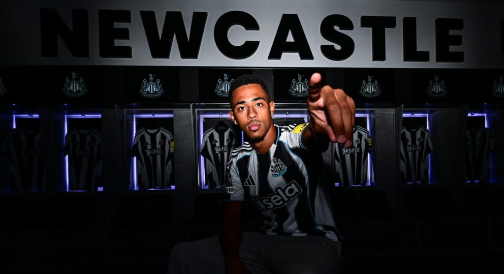 Jacob Ramsey poses inside Newcastle United's dressing room during his official unveiling
