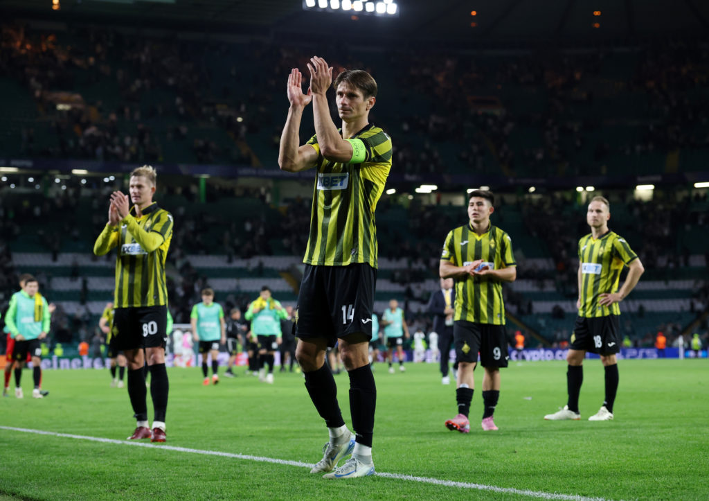 FC Kairat players applaud their fans after facing Celtic in a Champions League qualifier.
