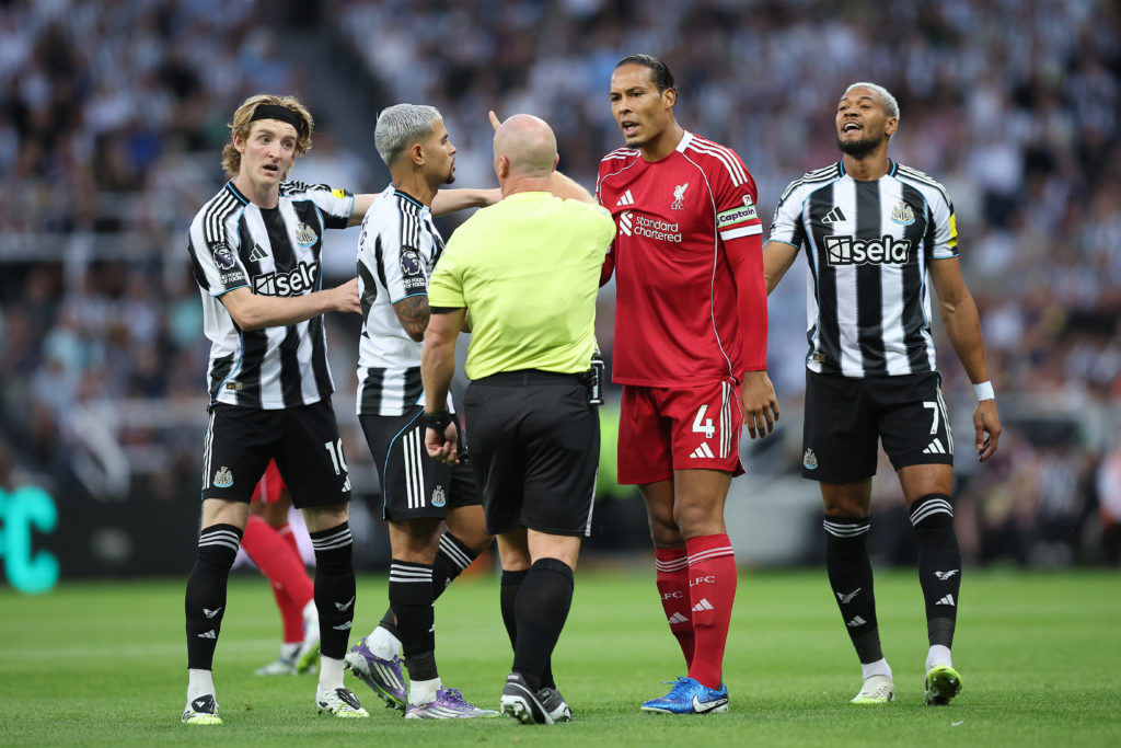 Virgil van Dijk speaks to referee Simon Hooper alongside Anthony Gordon, Bruno Guimaraes and Joelinton during Liverpool's win over Newcastle United.