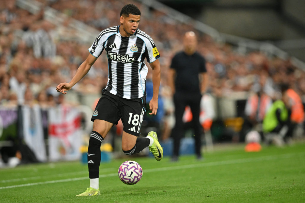 Will Osula runs with the ball during Newcastle United's game against Liverpool.