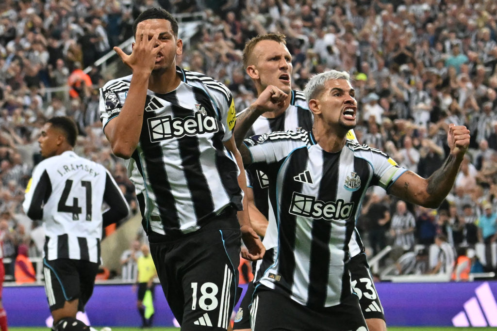 William Osula celebrates after scoring in a Premier League game between Newcastle United and Liverpool.