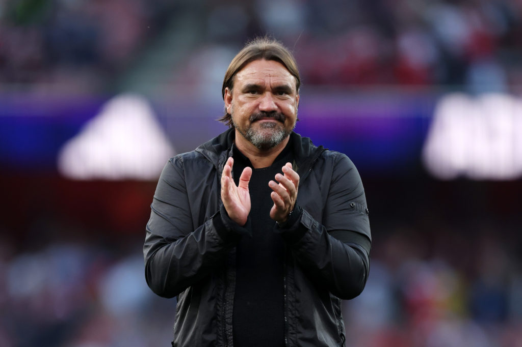 Daniel Farke claps towards fans after Leeds lose to Arsenal in the Premier League.