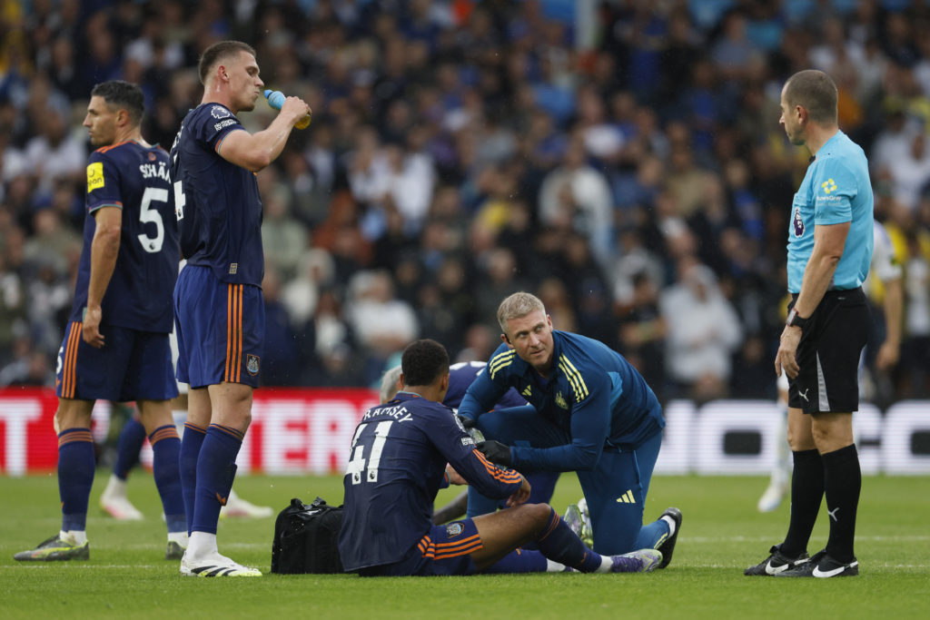 Jacob Ramsey is treated for an injury during Leeds vs Newcastle United.