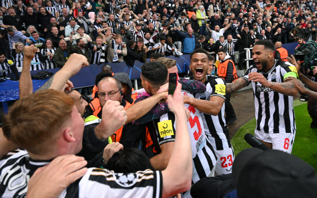Newcastle United players celebrate Fabian Schar's goal in the Champions League against PSG.