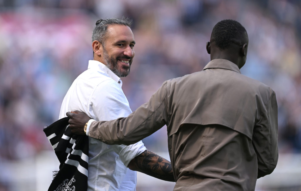 Jonas Gutierrez and Papiss Cisse are welcomed onto the St James' Park pitch at half-time during a Newcastle United game.