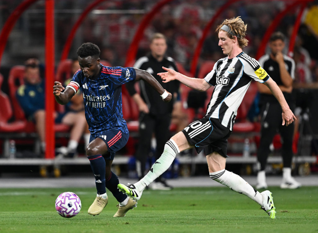 Bukayo Saka runs past Anthony Gordon during a pre-season friendly between Arsenal and Newcastle United.