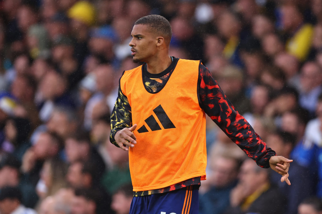 Malick Thiaw warms up before a Premier League game between Leeds United and Newcastle United.