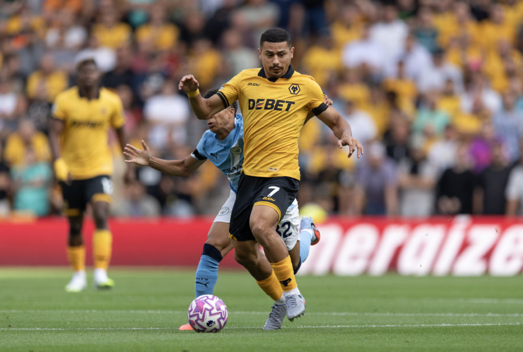 Andre carries the ball during a Premier League game between Wolves and Manchester City.