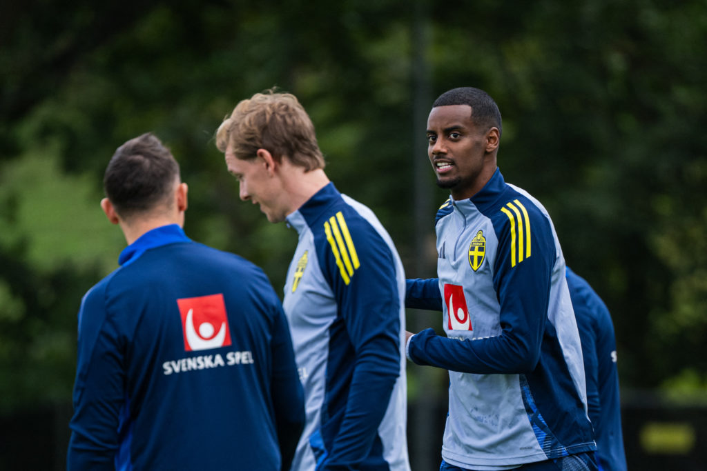 Liverpool's Alexander Isak looks at former Newcastle United teammate Emil Krafth during a Sweden training session.