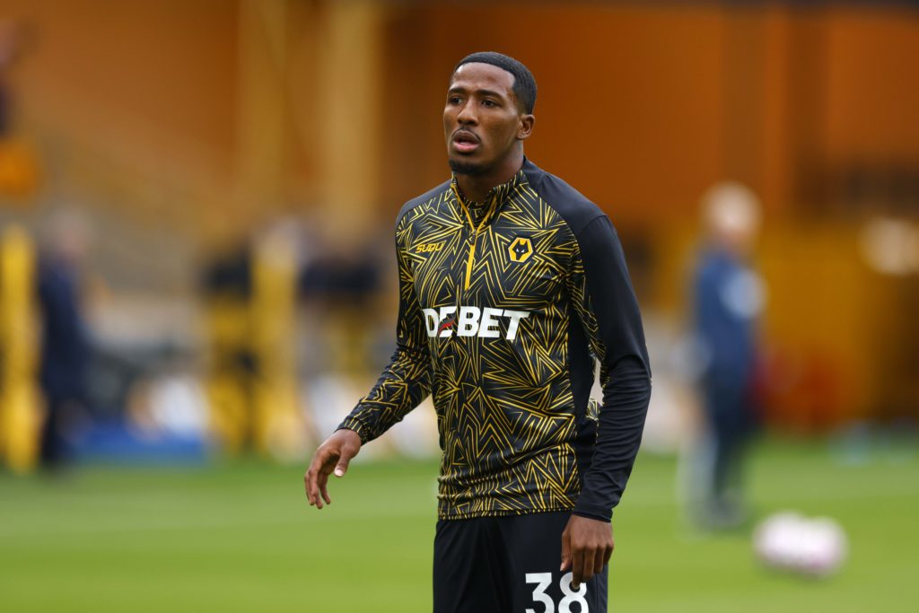 Jackson Tchatchoua warms up before a Premier League game between Wolves and Everton